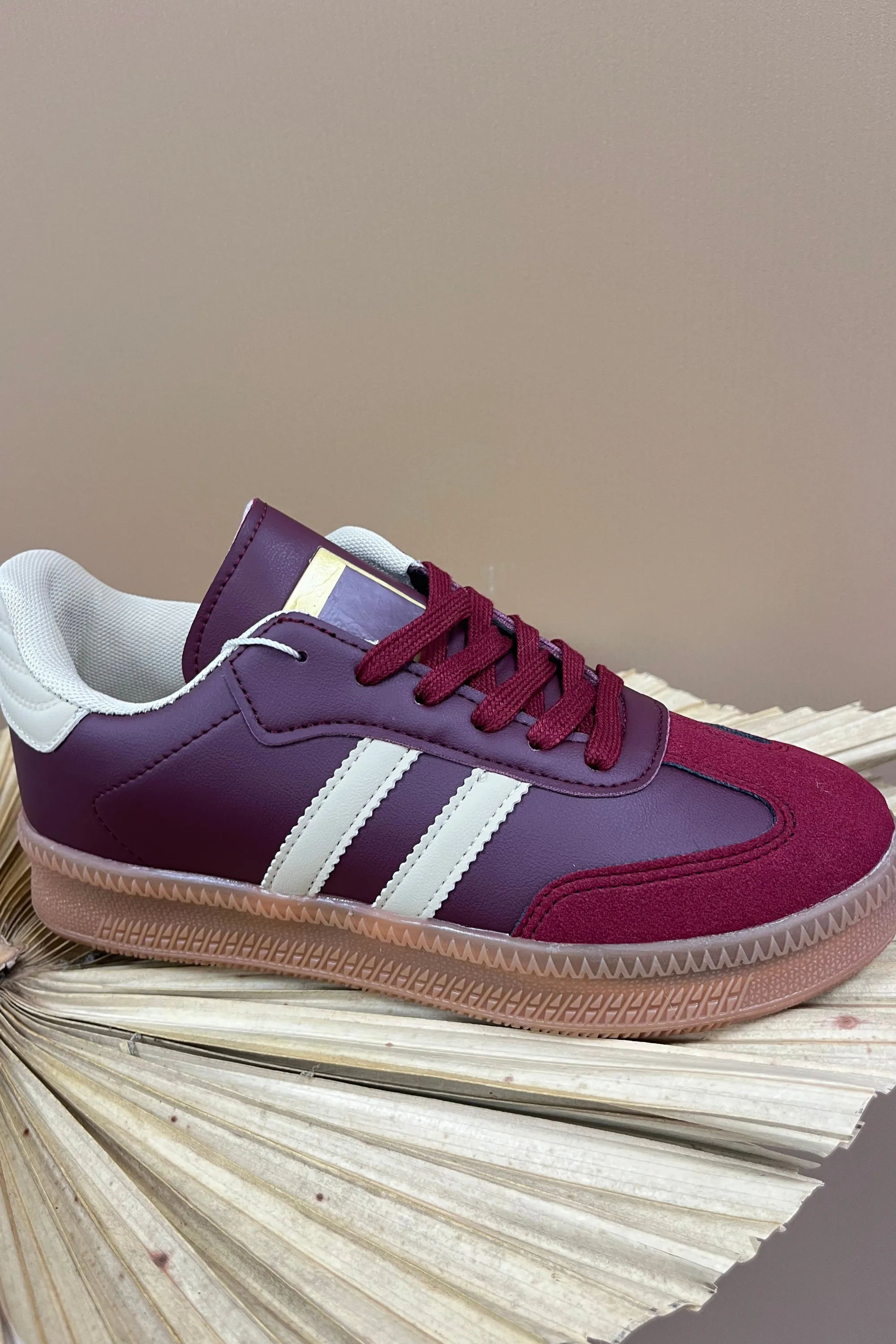 Burgundy lace up trainers